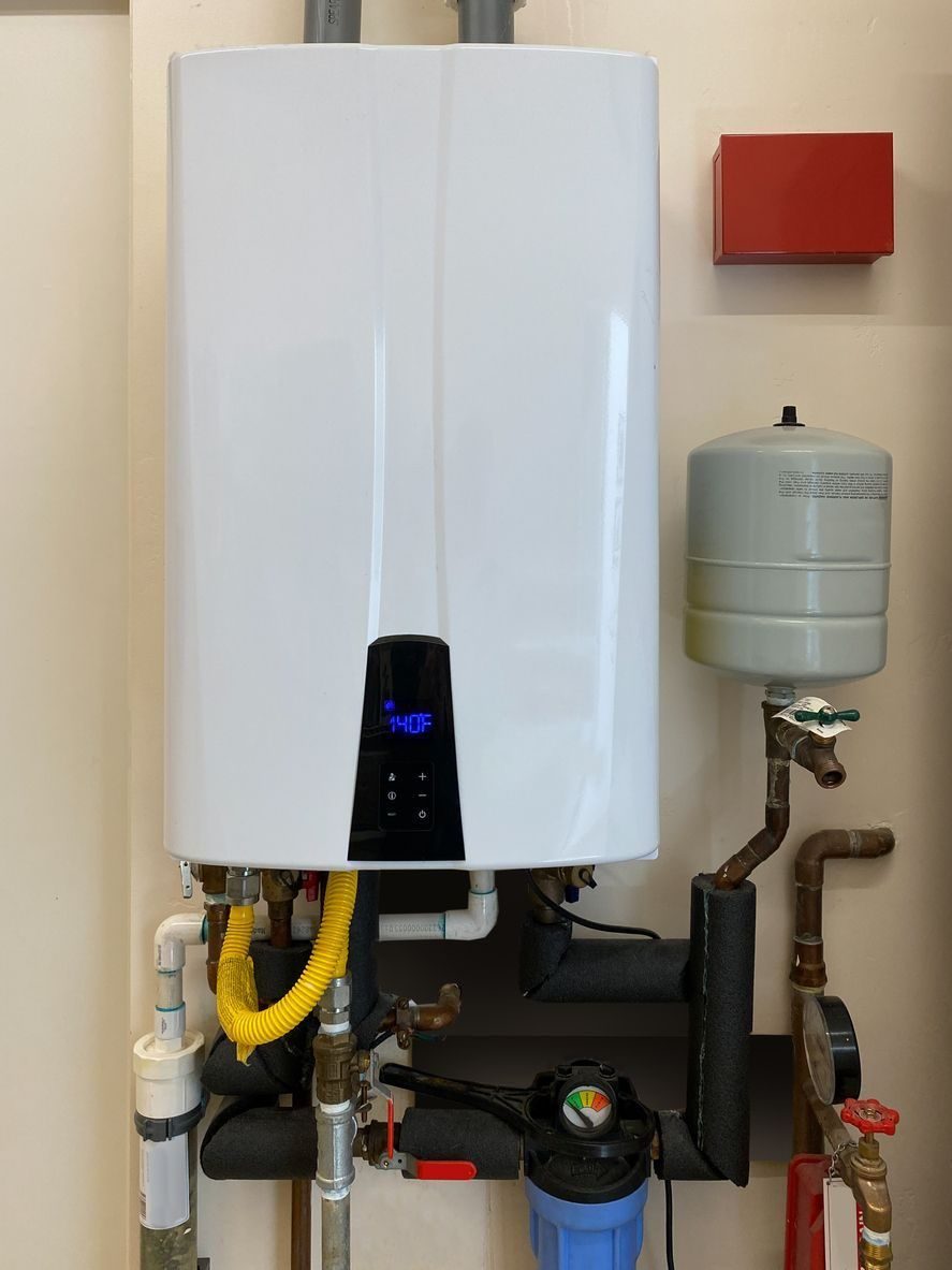 tankless water heater with expansion tank mounted on a wall